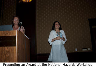 Presenting an Award at the National Hazards Workshop